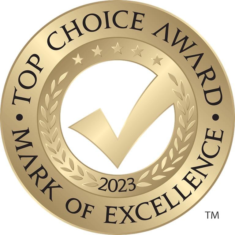 A gold circular emblem featuring a large check mark in the center, with Top Choice Award, Mark of Excellence, 2023 around the edges. Stars and laurel leaves embellish the design—a true testament to Greater Vancouvers Top Choice Roofing Company.